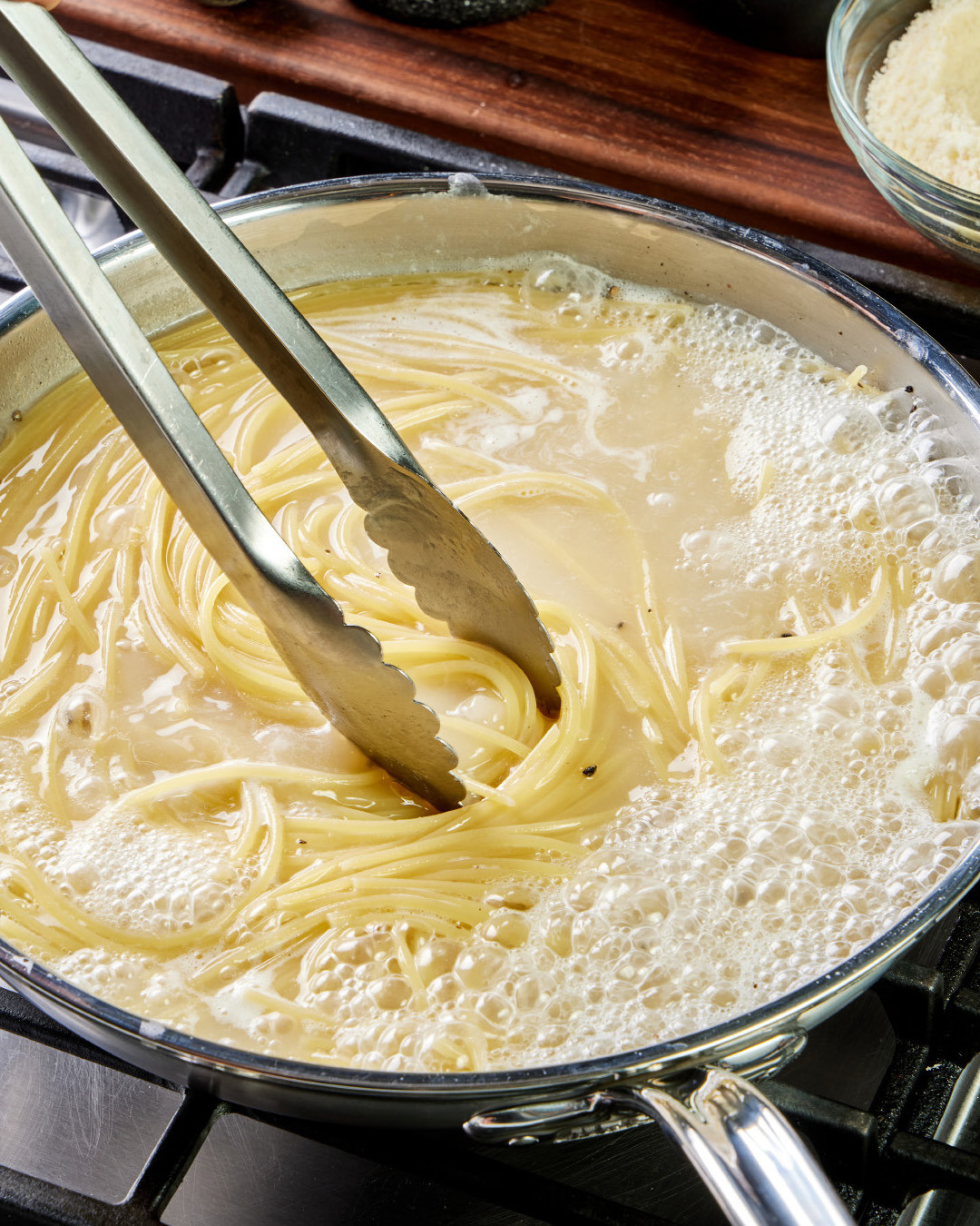 4. Cook until just shy of al dente; the pasta will no longer be fully submerged and there should be at least 1 cup of starchy liquid in the pan.