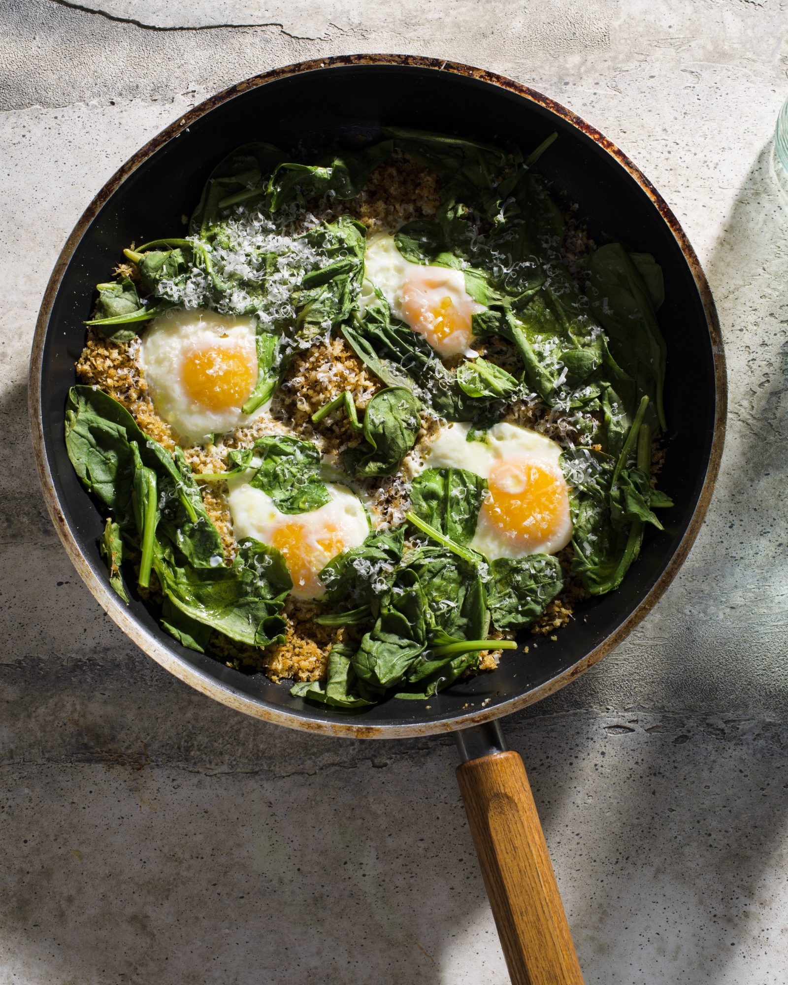 Eggs fried in parmesan breadcrumbs wilted spinach v1