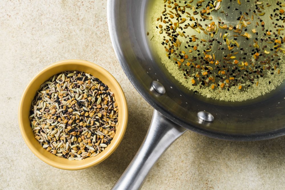 Use panch phoron—an Indian spice blend—to make a savory flavored oil for drizzling.