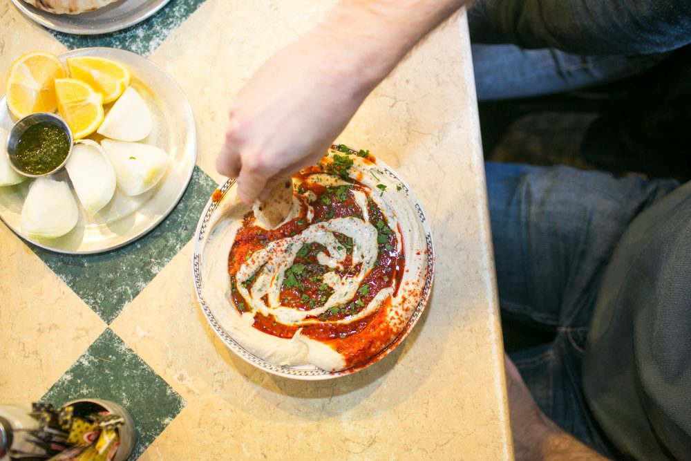 At Shlomo & Doron, near Tel Aviv’s massive outdoor Carmel Market, the toppings are as important as the hummus itself. Ful (pureed favas) and shakshuka (tomatoes and eggs) are the two most popular.