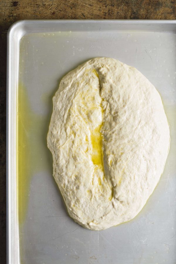 1. Pour the dough onto the prepared baking sheet and let rest for 20 minutes.