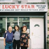 Angela and her parents outside the takeaway on the last day of service in 2018